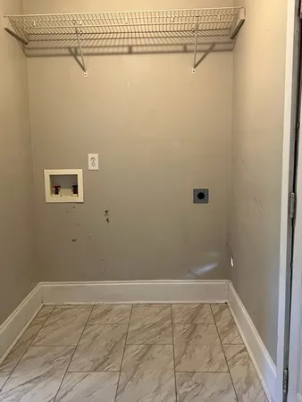 a view of a utility room with racks on the wall