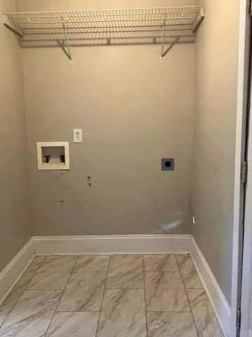 a view of a utility room with racks on the wall