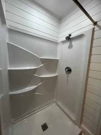 a view of a room with racks on the wall
