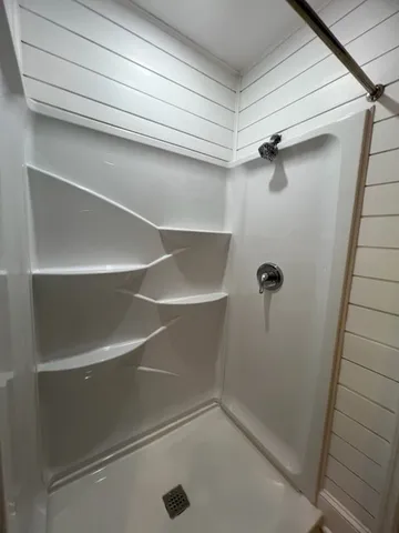 a view of a room with racks on the wall