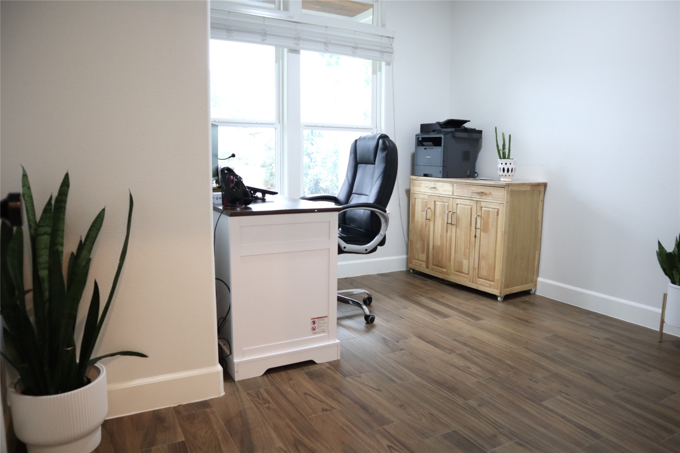20602 Oak Ridge Lago Vista, TX 78645 - Photo 25 of 35 Rich wood plank flooring sets a warm tone in this versatile home workspace.