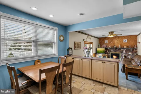 a kitchen that has a table and chairs in it