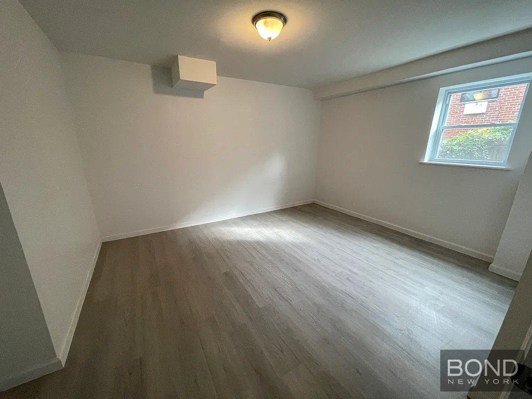 45 Monitor Street, Unit 1 Brooklyn, NY 11222 - Photo 12 of 12 an empty room with windows