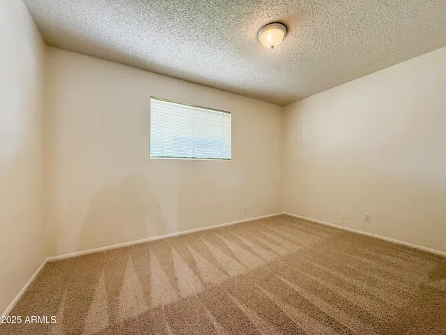 an empty room with a bench