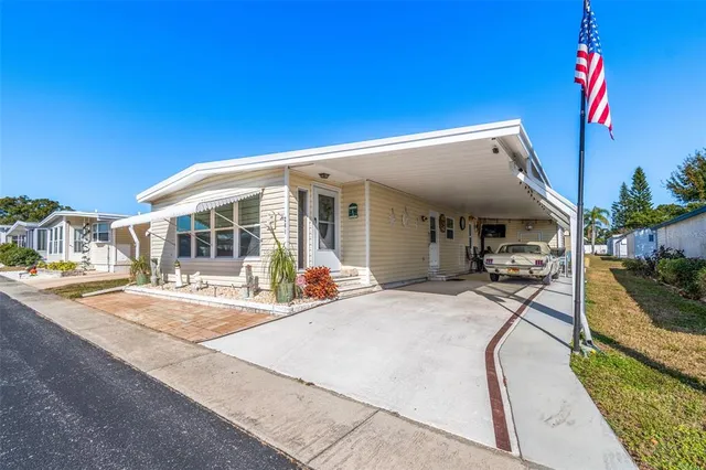 a view of a house with sitting area and view of a swimming pool