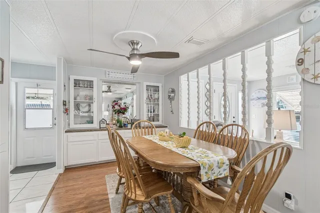 a view of a a dining room with furniture window and outside view