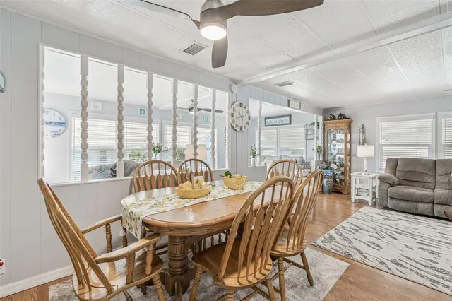 a view of a dining room with furniture window and outside view