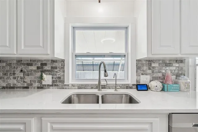 a kitchen with a sink and a window