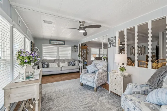 a living room with furniture and view of living room