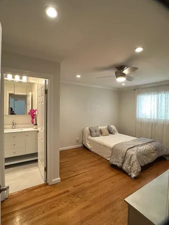 a bed room with two bed and a closet