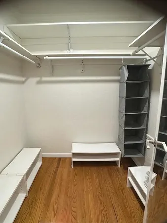 a view of room with wooden floor and chair