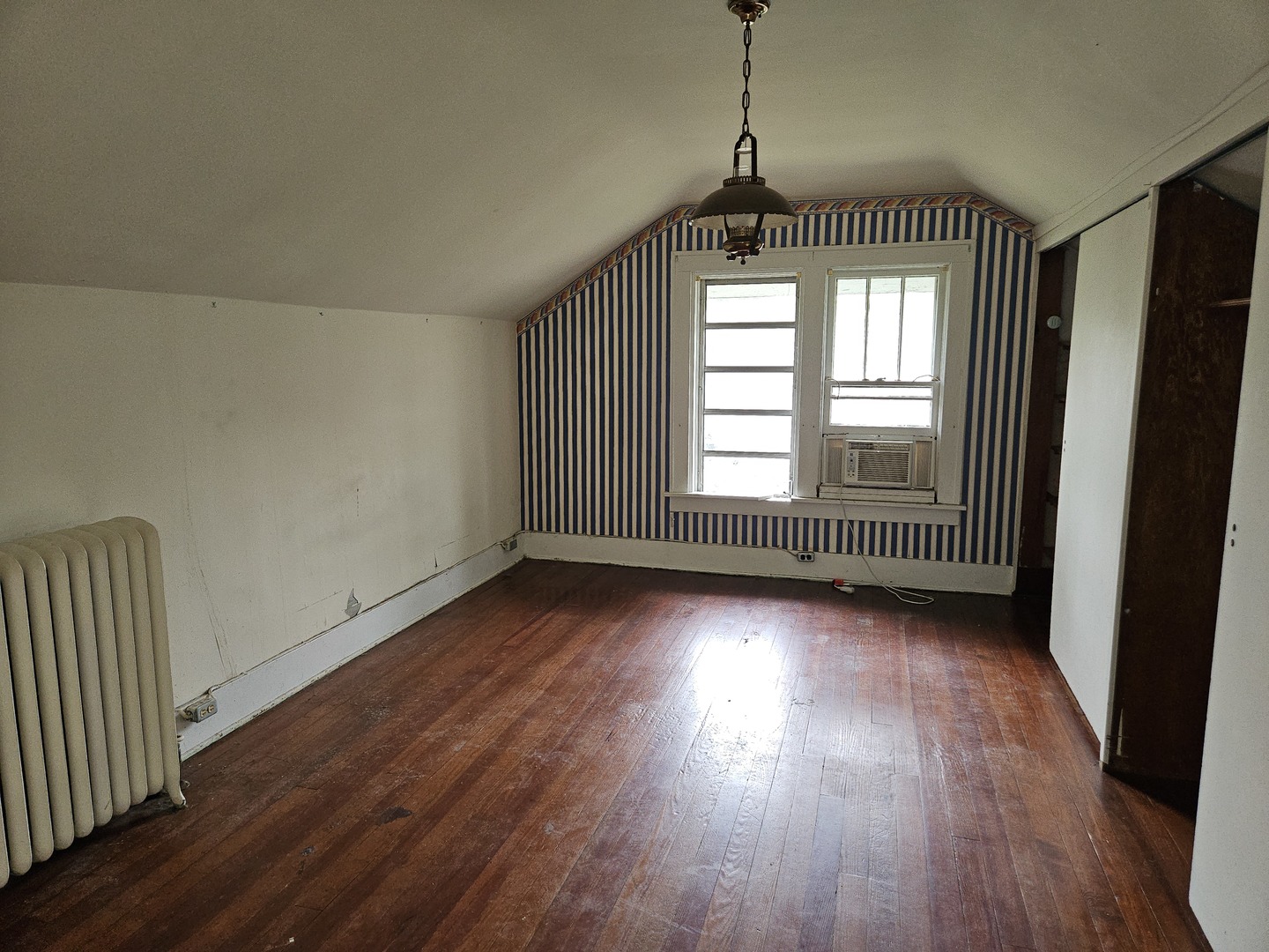 402 East 5th Street Flora, IL 62839 - Photo 24 of 29 an empty room with wooden floor and windows