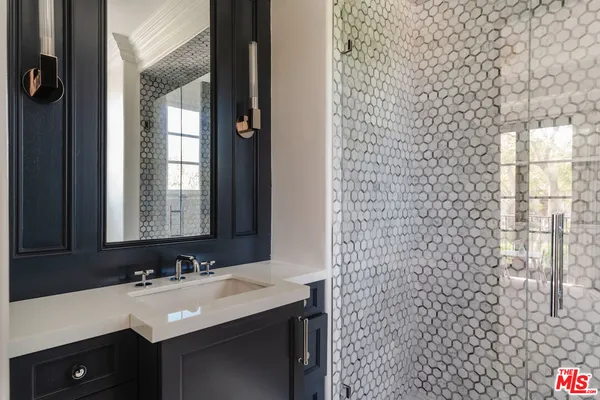 a bathroom with a sink and a mirror