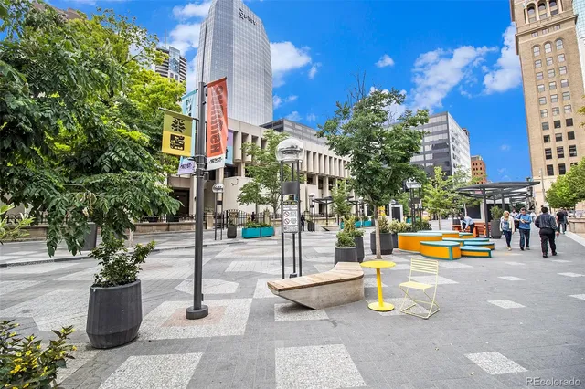 a view of a street with benches