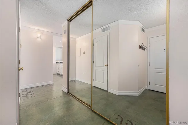 a bathroom with a shower and a glass door