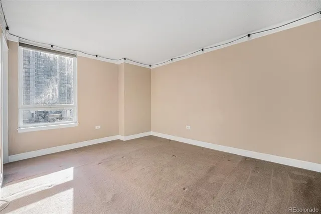 a view of an empty room with a window