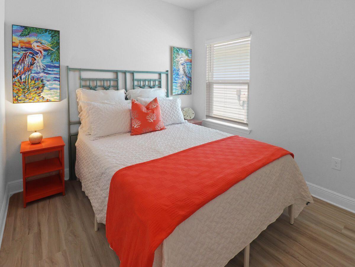 769 Backwater Road Port St. Joe, FL 32456 - Photo 14 of 45 a bedroom with a bed and wooden floor
