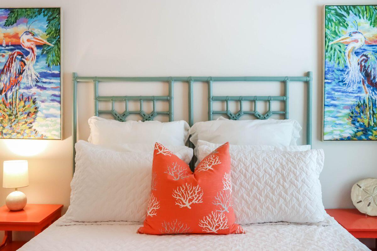 769 Backwater Road Port St. Joe, FL 32456 - Photo 16 of 45 a bed sitting in a bedroom next to a window