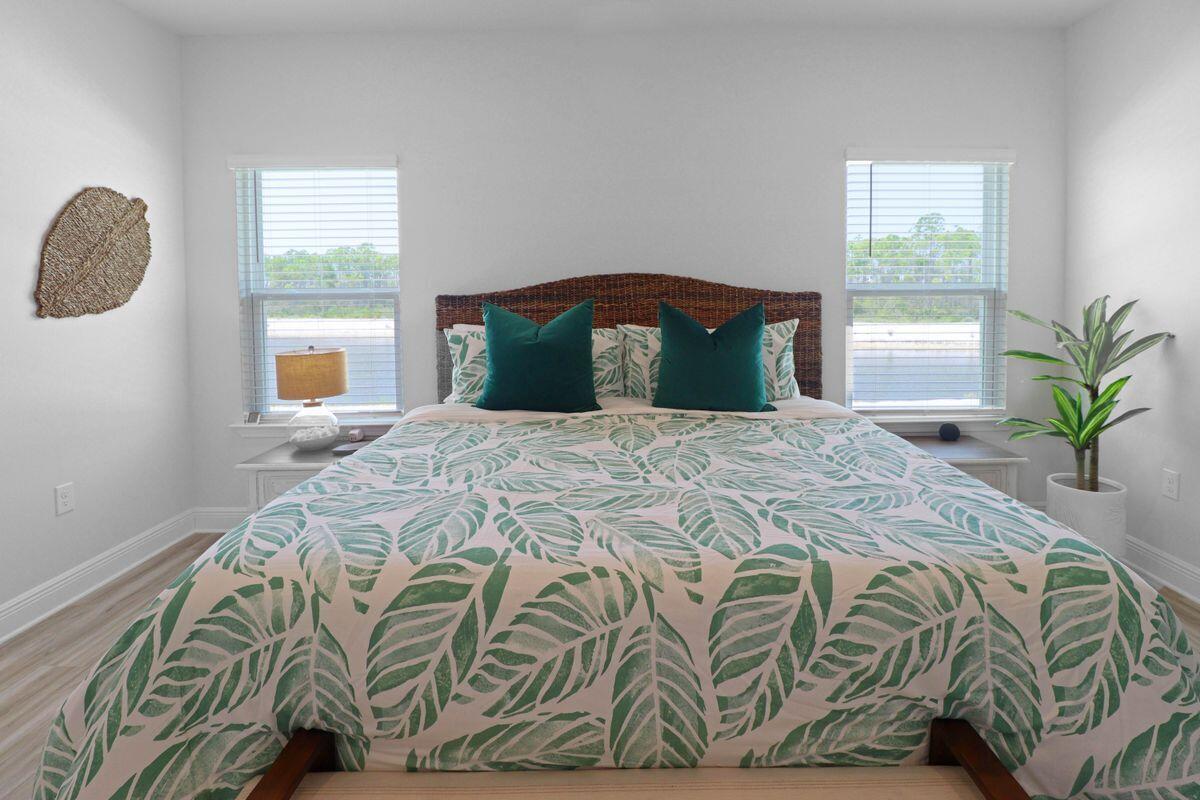 769 Backwater Road Port St. Joe, FL 32456 - Photo 19 of 45 a bedroom with a bed and a window