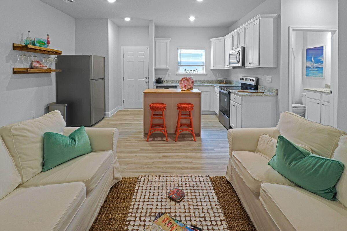 769 Backwater Road Port St. Joe, FL 32456 - Photo 26 of 45 a living room with furniture and a rug