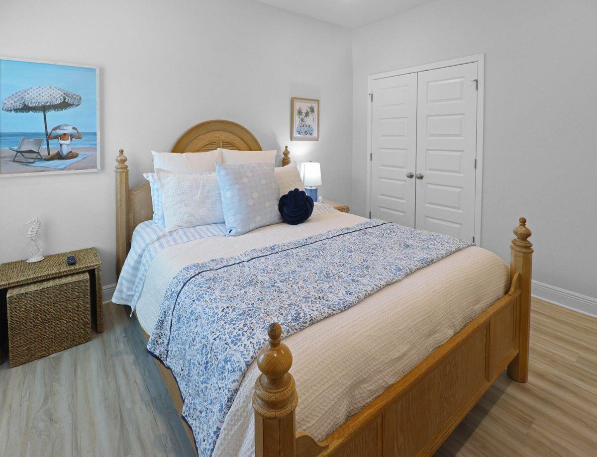 769 Backwater Road Port St. Joe, FL 32456 - Photo 29 of 45 a bedroom with a bed and dresser
