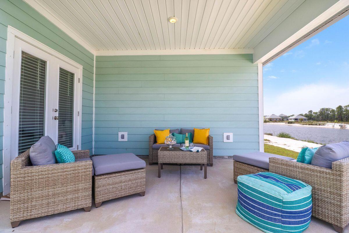 769 Backwater Road Port St. Joe, FL 32456 - Photo 32 of 45 a backyard of a house with outdoor seating