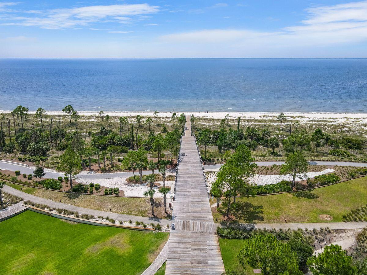 769 Backwater Road Port St. Joe, FL 32456 - Photo 36 of 45 a view of a swimming pool with an outdoor seating