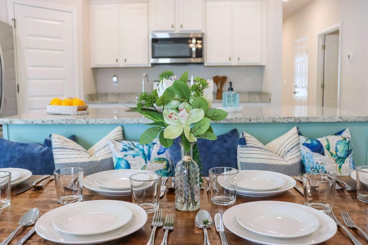 769 Backwater Road Port St. Joe, FL 32456 - Photo 10 of 45 a kitchen with a table and chairs