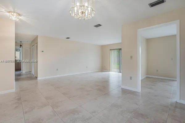 a view of an empty room with a bathroom