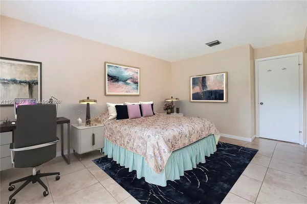 a bedroom with bed and window
