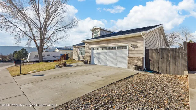 a view of a house with a snow on the road