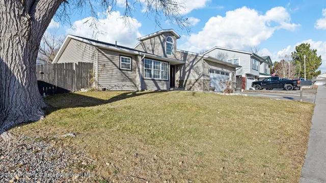 a view of a house with wooden stairs