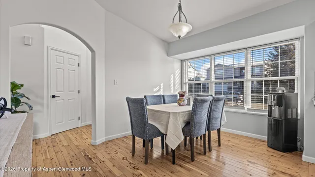 a view of a dining room with furniture window and wooden floor