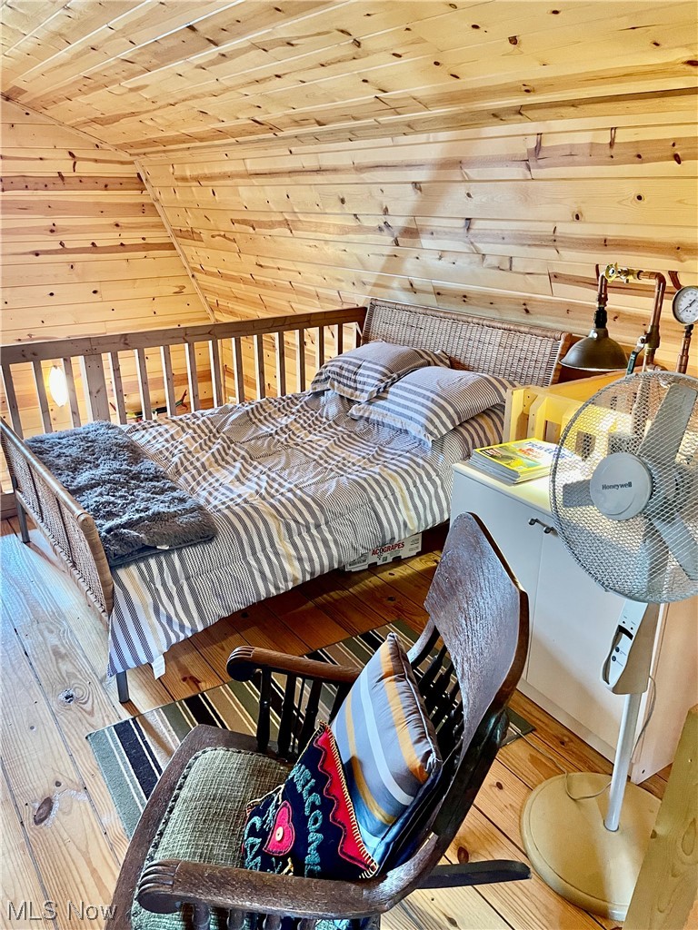 43188 Krieg Road New Matamoras, OH 45767 - Photo 23 of 35 Hardwood floored bedroom featuring wood ceiling and vaulted ceiling