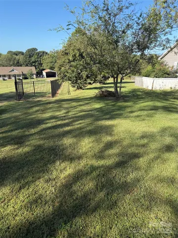 a swimming pool view with a lake view