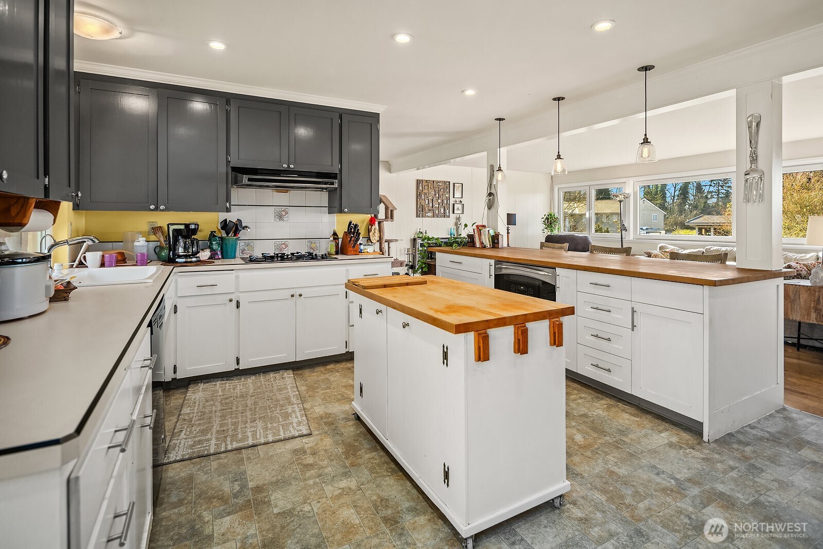 856 Stetson Avenue Kent, WA 98031 - Photo 15 of 39 a kitchen with a stove sink and cabinets