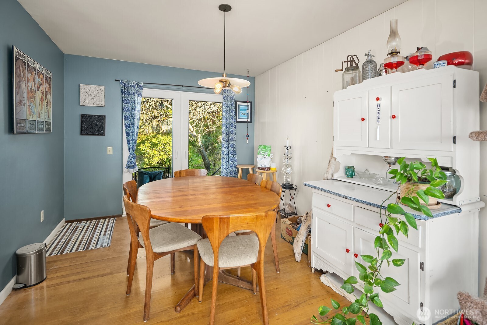 856 Stetson Avenue Kent, WA 98031 - Photo 19 of 39 a view of a dining room with furniture window and wooden floor