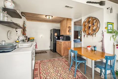 a kitchen with a cabinets and appliances