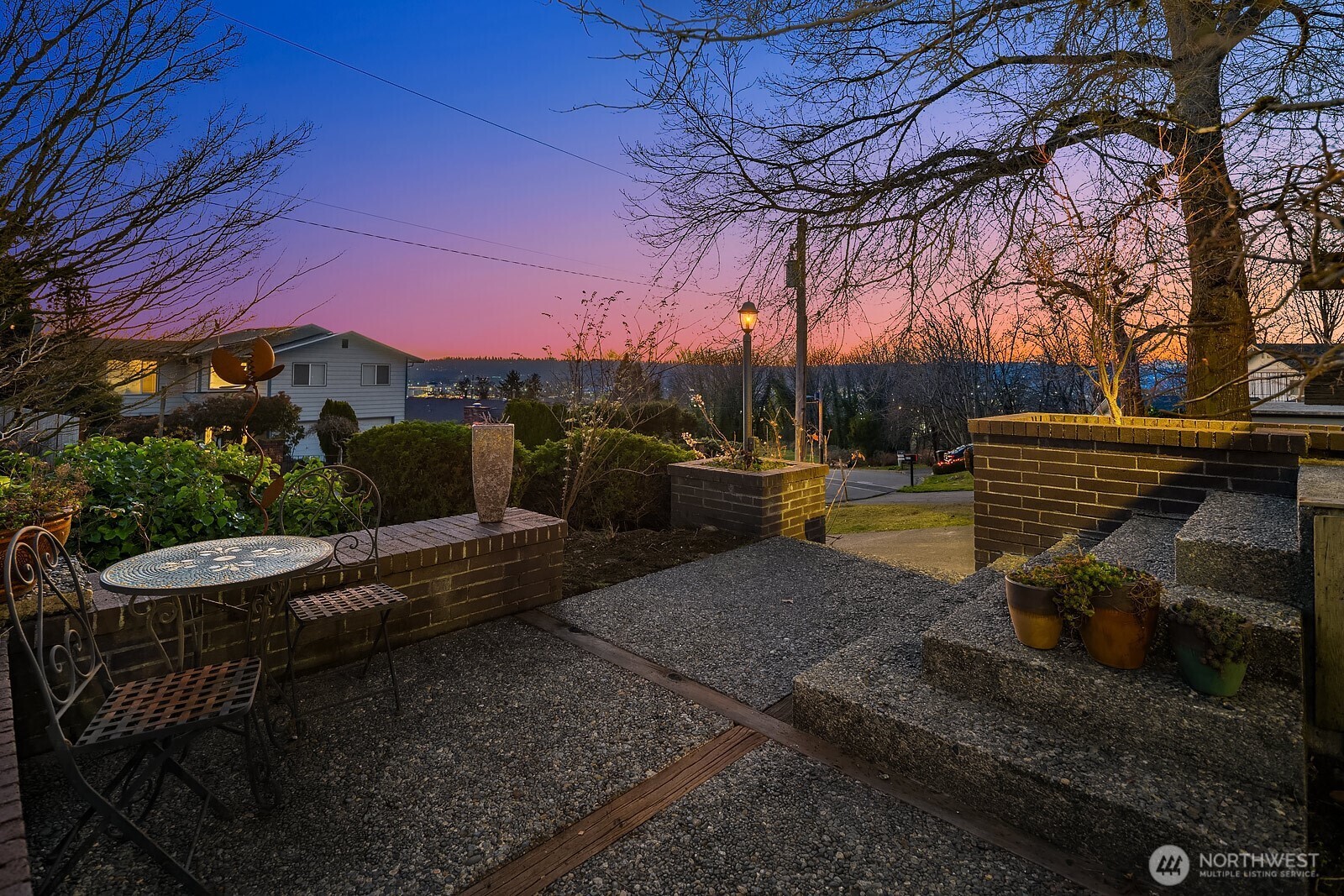 856 Stetson Avenue Kent, WA 98031 - Photo 34 of 39 a view of patio with table and chairs under an umbrella