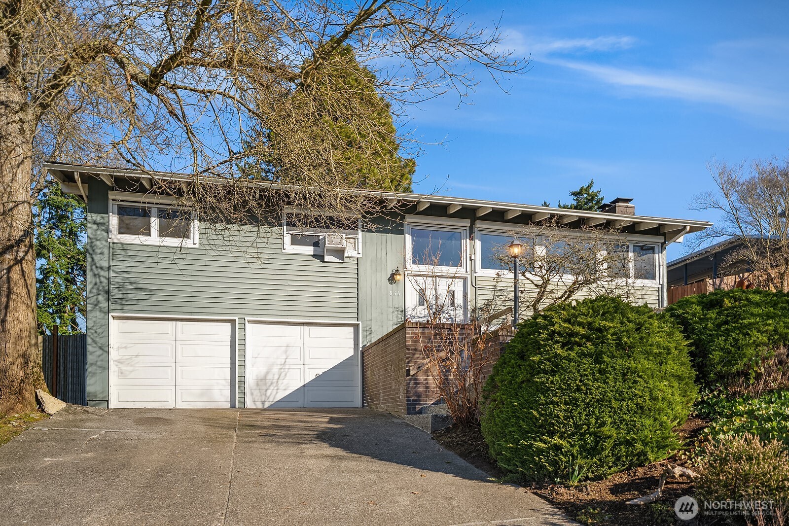 856 Stetson Avenue Kent, WA 98031 - Photo 4 of 39 a view of a house with a yard and potted plants