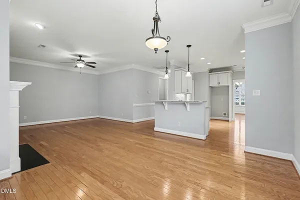 a view of a kitchen with a stove cabinets and wooden floor