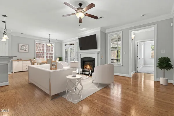 a living room with furniture fireplace and a flat screen tv