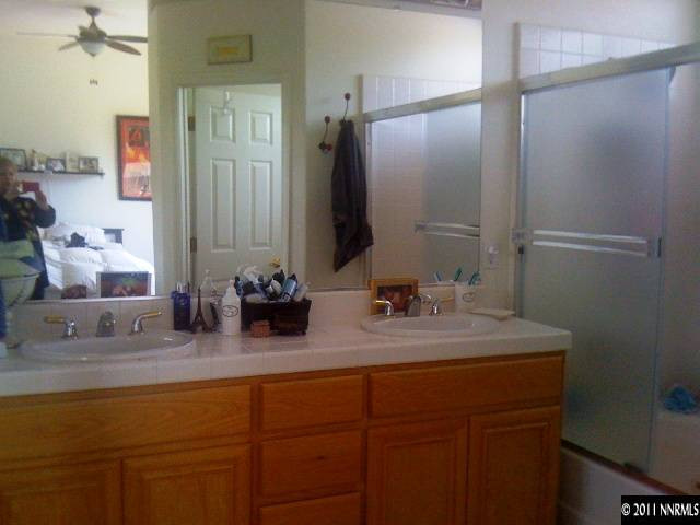 2799 Newburgh Way Reno, NV 89523 - Photo 6 of 9 a bathroom with a double vanity sink and a mirror