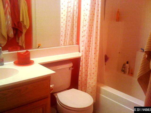 2799 Newburgh Way Reno, NV 89523 - Photo 8 of 9 a bathroom with a sink a toilet and shower