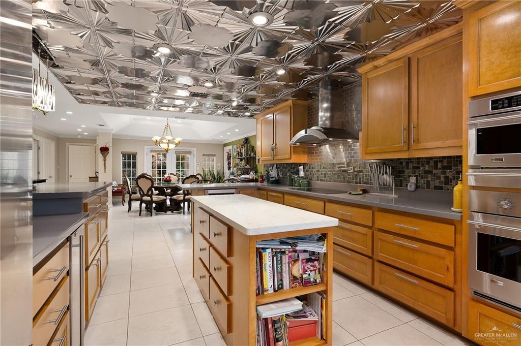 301 Vermont Avenue McAllen, TX 78503 - Photo 11 of 25 a large kitchen with lots of counter space and stainless steel appliances