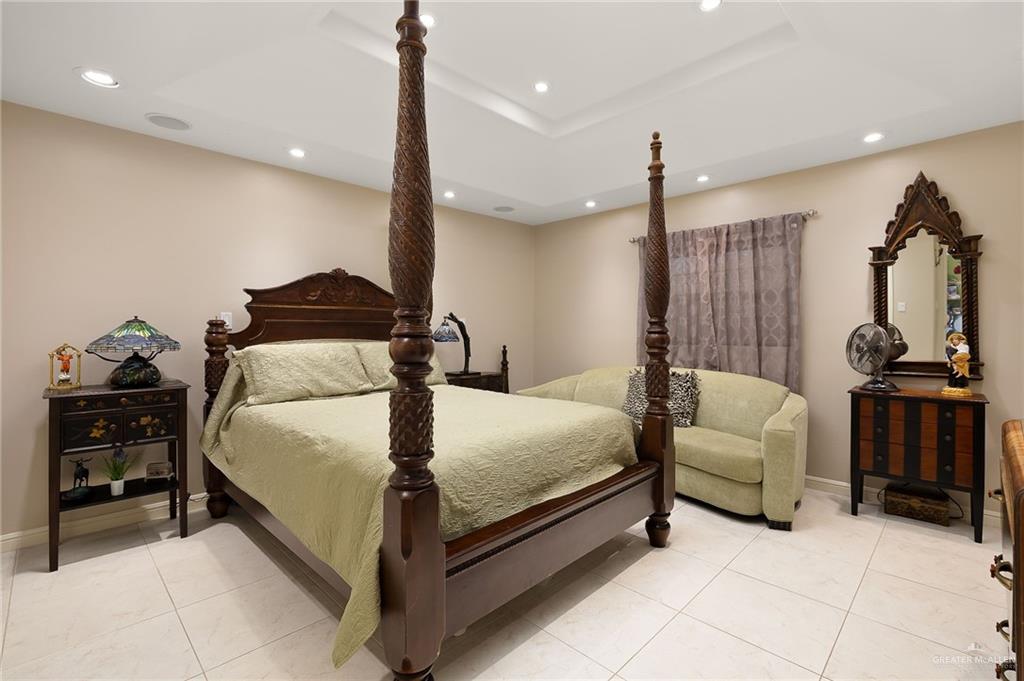 301 Vermont Avenue McAllen, TX 78503 - Photo 13 of 25 a bedroom with a bed and furniture