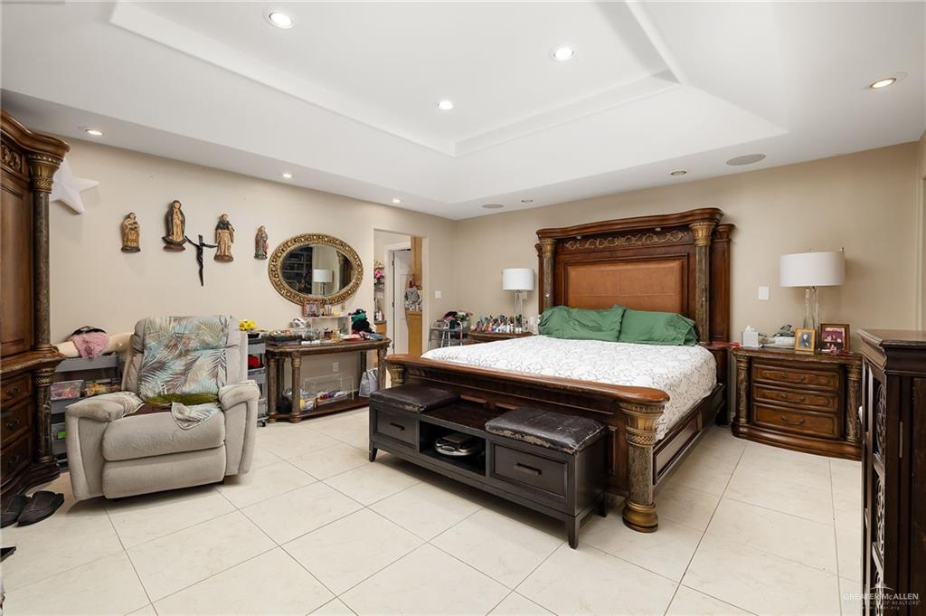 301 Vermont Avenue McAllen, TX 78503 - Photo 15 of 25 a spacious bedroom with a bed and a couch