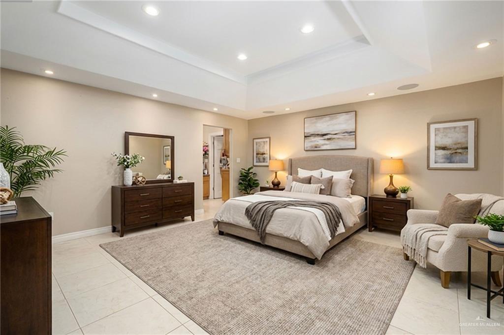 301 Vermont Avenue McAllen, TX 78503 - Photo 16 of 25 a spacious bedroom with a large bed and a dresser