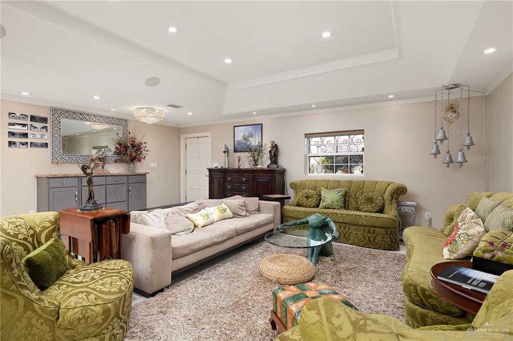 301 Vermont Avenue McAllen, TX 78503 - Photo 4 of 25 a living room with furniture and a chandelier