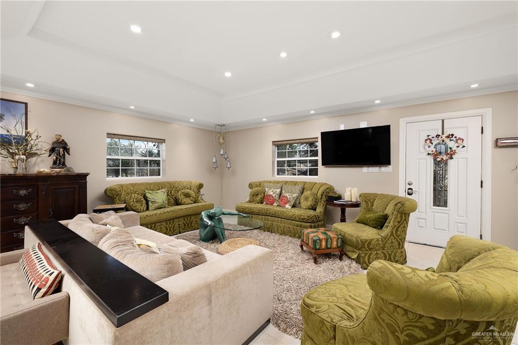 301 Vermont Avenue McAllen, TX 78503 - Photo 5 of 25 a living room with furniture and a flat screen tv